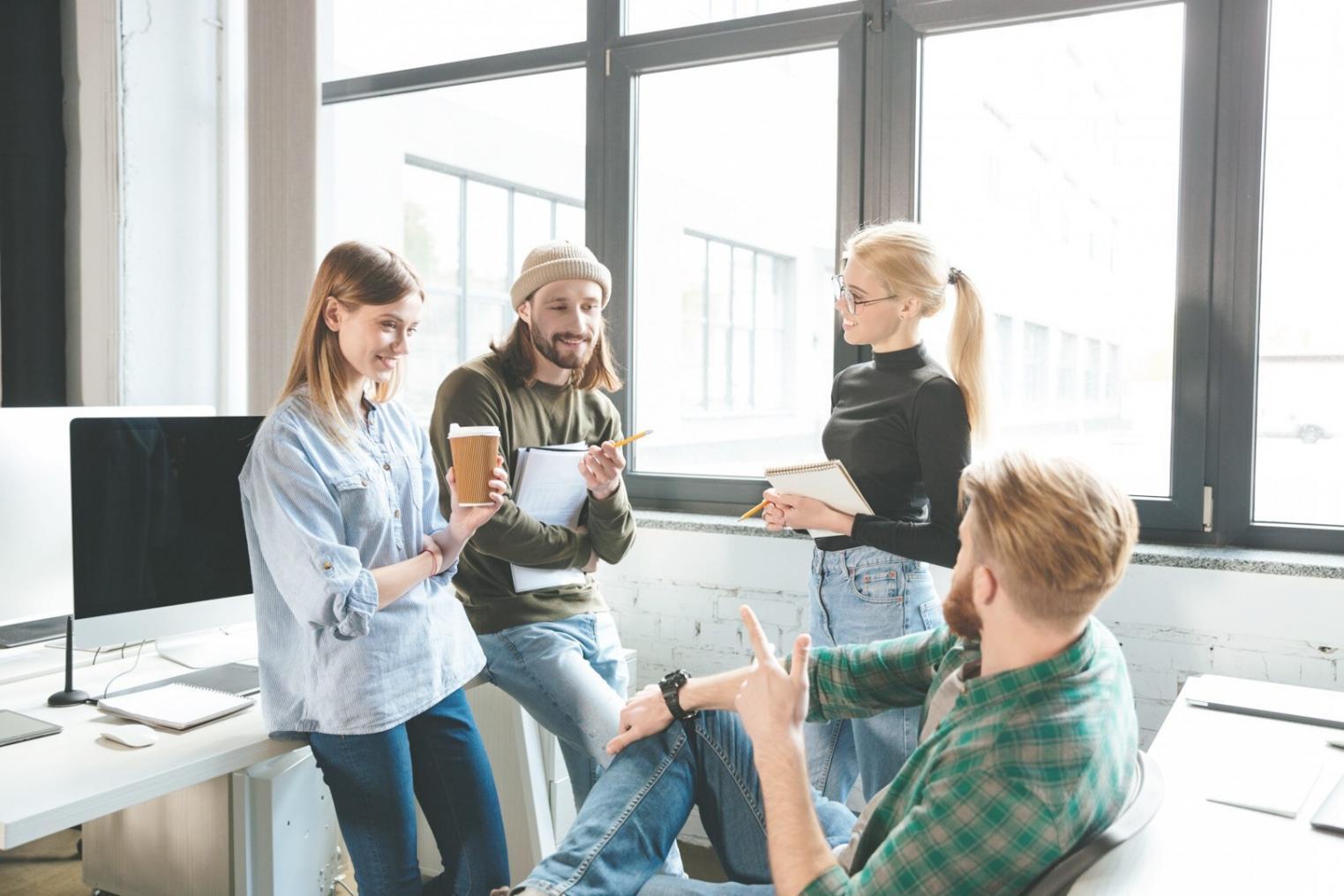 Students practicing negotiation techniques in small group setting